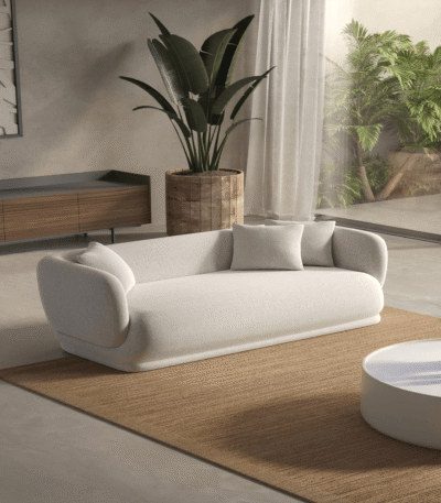 Modern 2-seater sofa in neutral fabric, displayed in a stylish living room setting