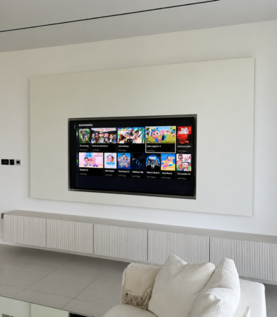 Modern minimalist floating TV wall unit with fluted cabinet by Bahoo Interior for luxury living rooms in the UAE.