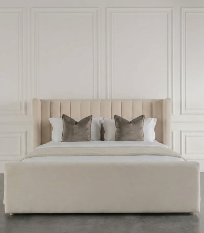 Belgrave Fluted Wing bed with vertical fluted headboard, deep wingback sides, and plush upholstered footboard